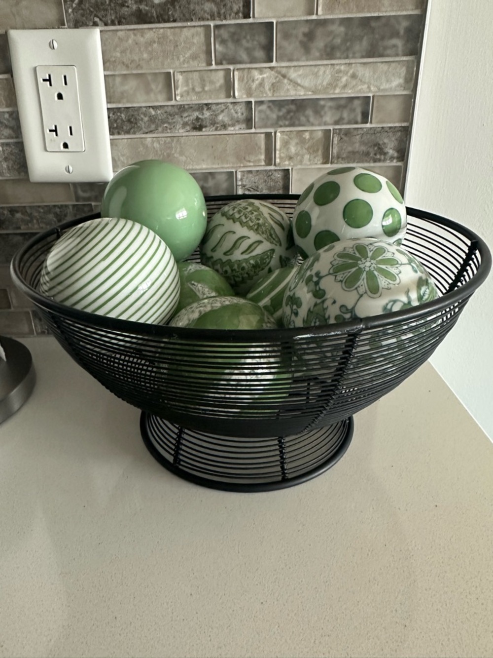 Decorative Green Ceramic Accent Balls in Black Wire Bowl